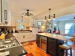 Beautiful well-equipped kitchen with island and beverage cooler